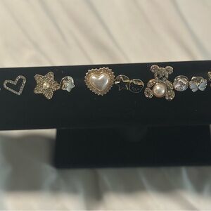 Assorted Gold and Silver Brooches Set with Heart and Star Accents